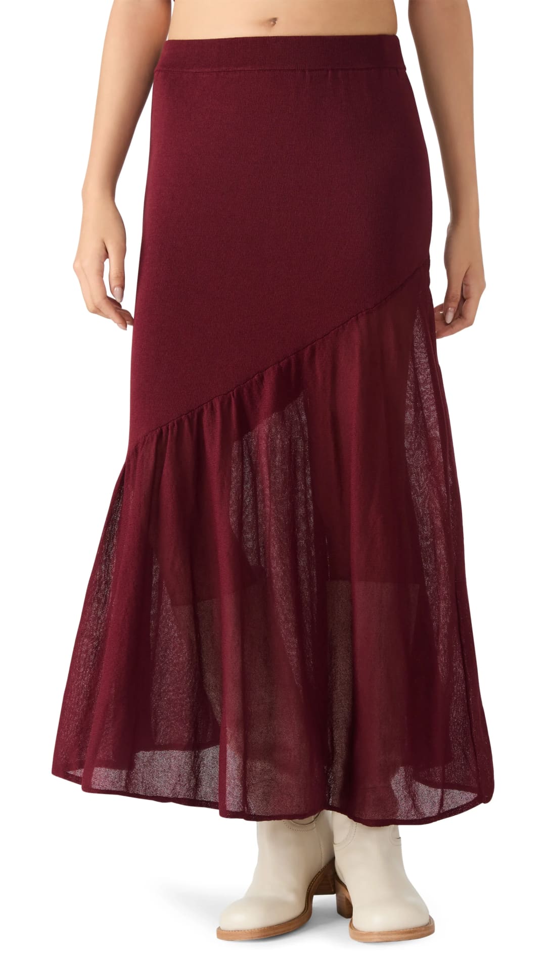 A long, dark red skirt with a sheer, ruffled hem and an asymmetrical design.