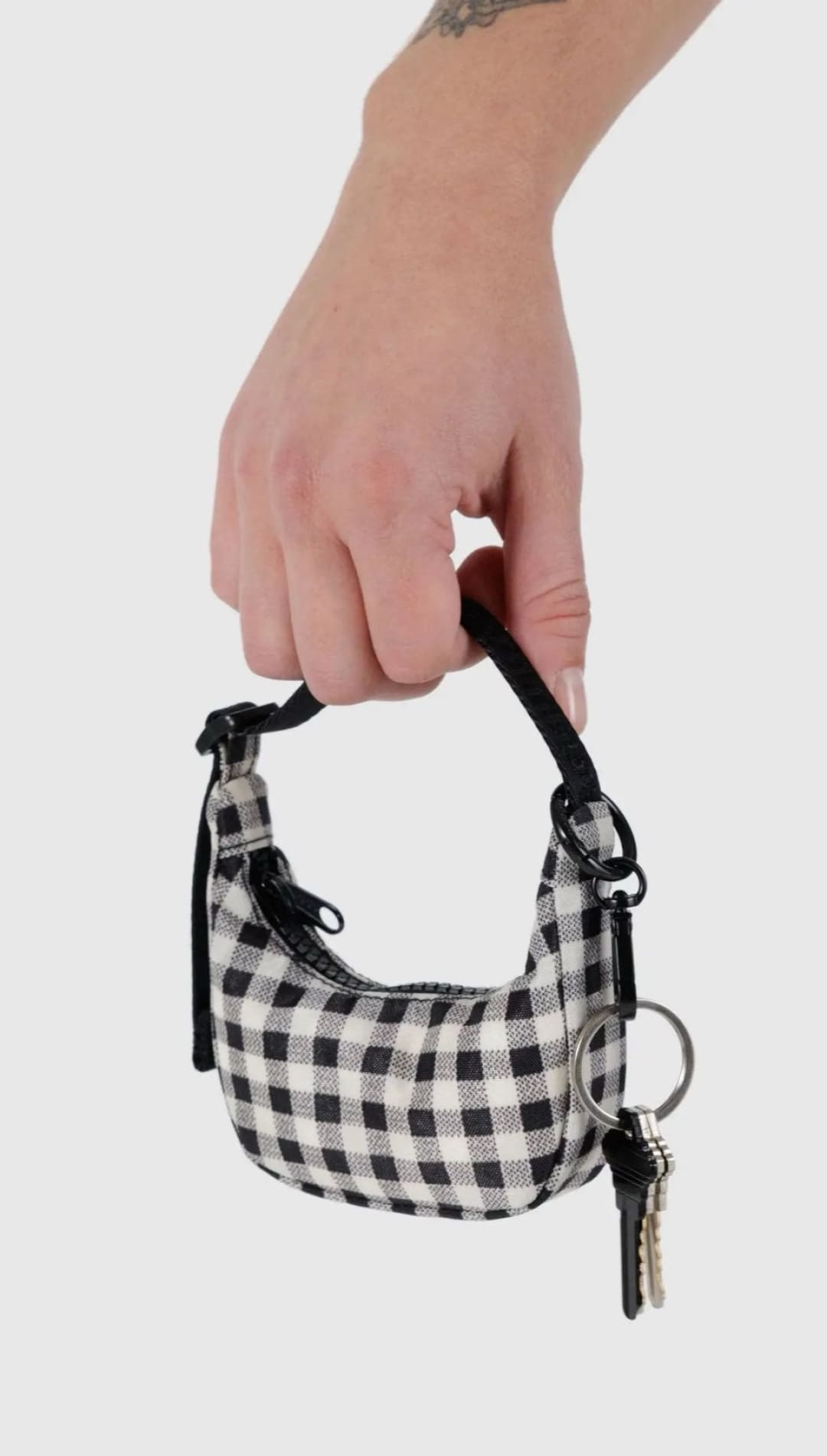 Black and white checkered purse with keys.