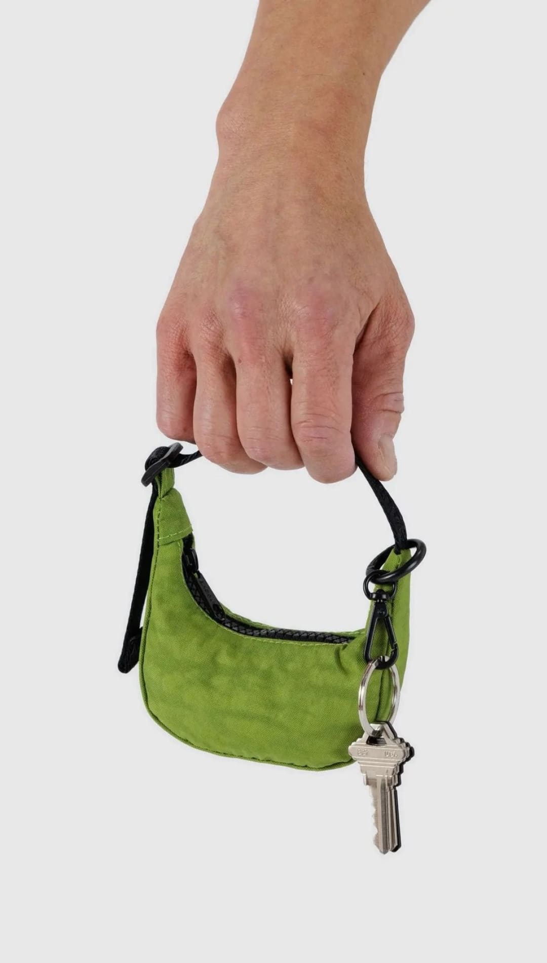 Green mini purse with key.