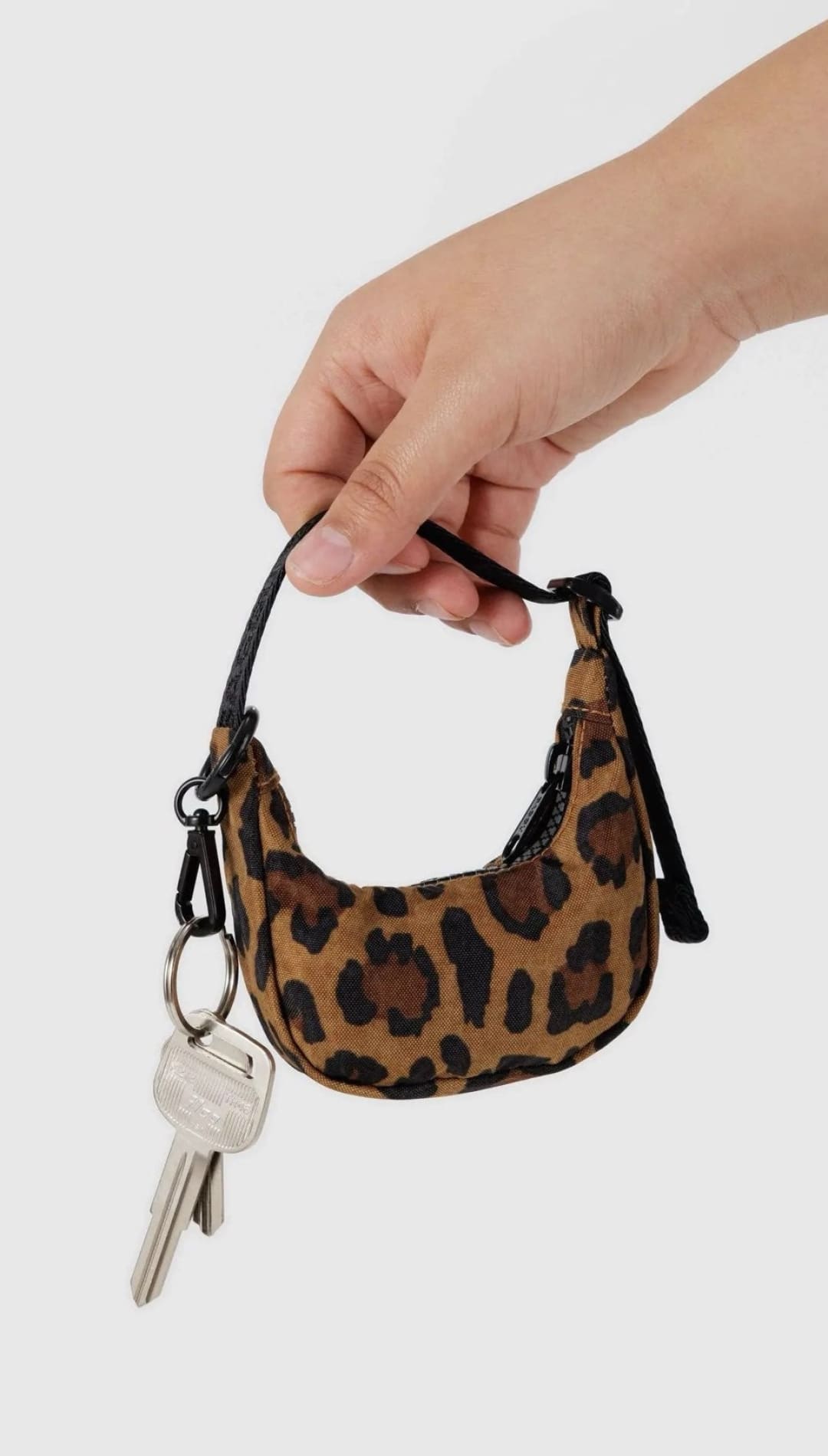 Leopard print mini purse with keys.