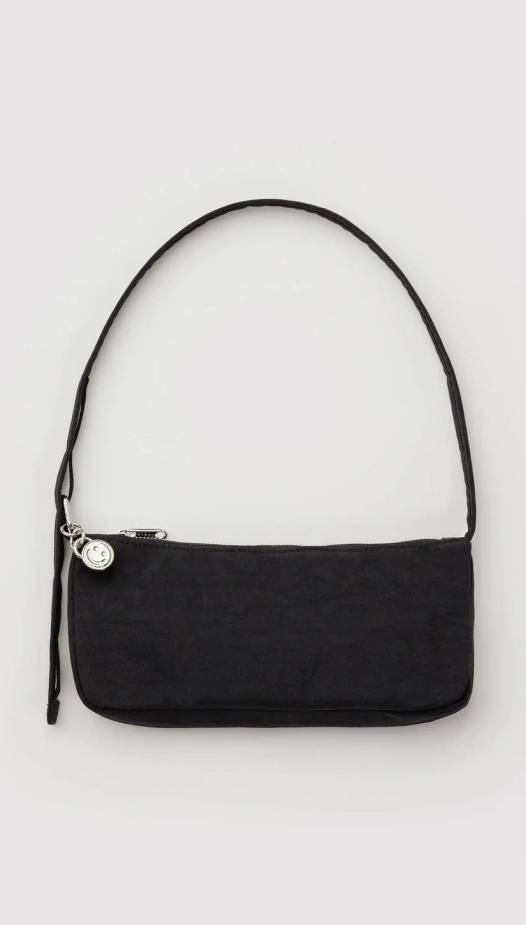 Black minimalist shoulder bag with silver hardware and adjustable strap.