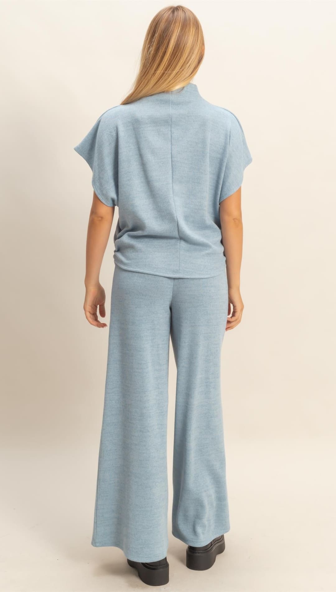 Light blue two-piece lounge set with a short-sleeve top and wide-leg pants.