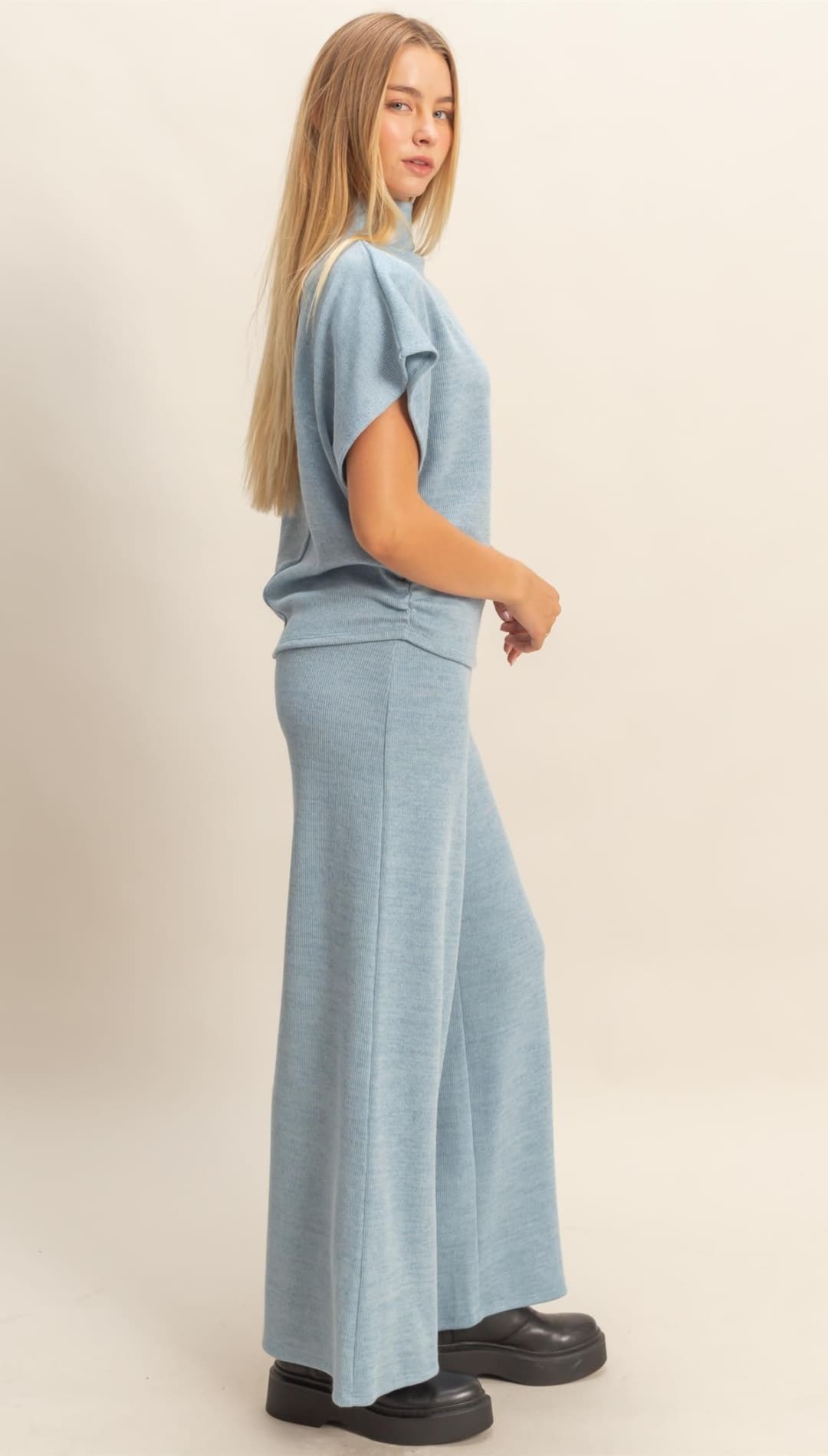 A woman’s light blue short-sleeved top and wide-leg pants set.