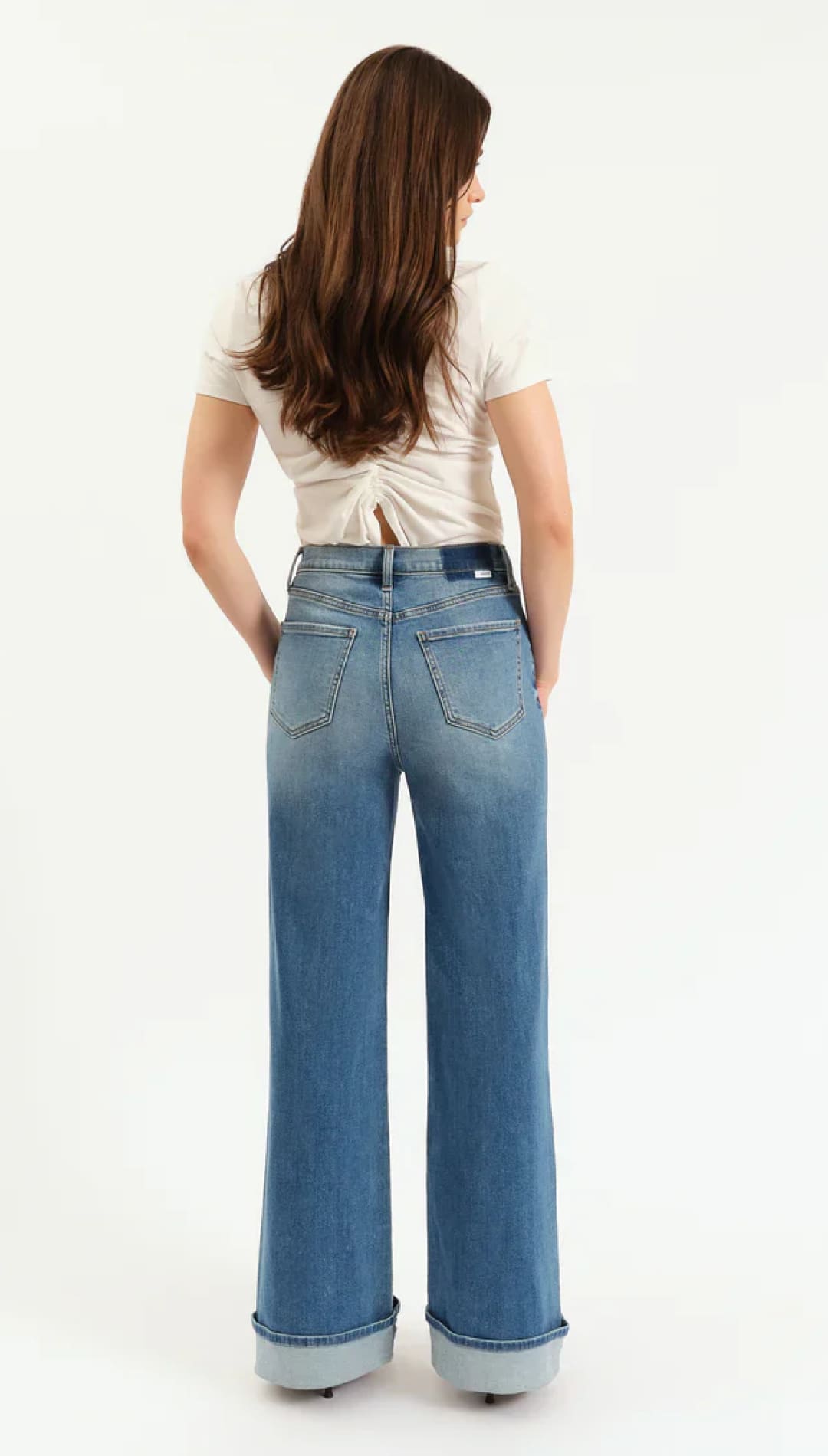 Blue high-waisted jeans with a straight leg design and white stitching.