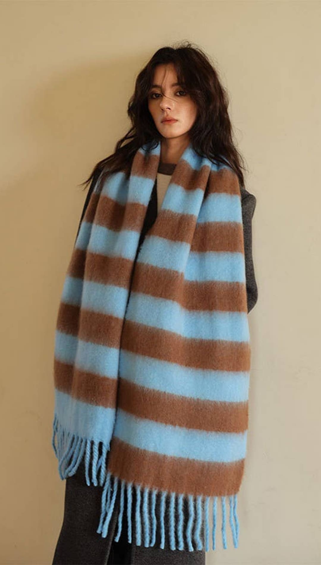 Blue and brown striped oversized scarf with fringes.