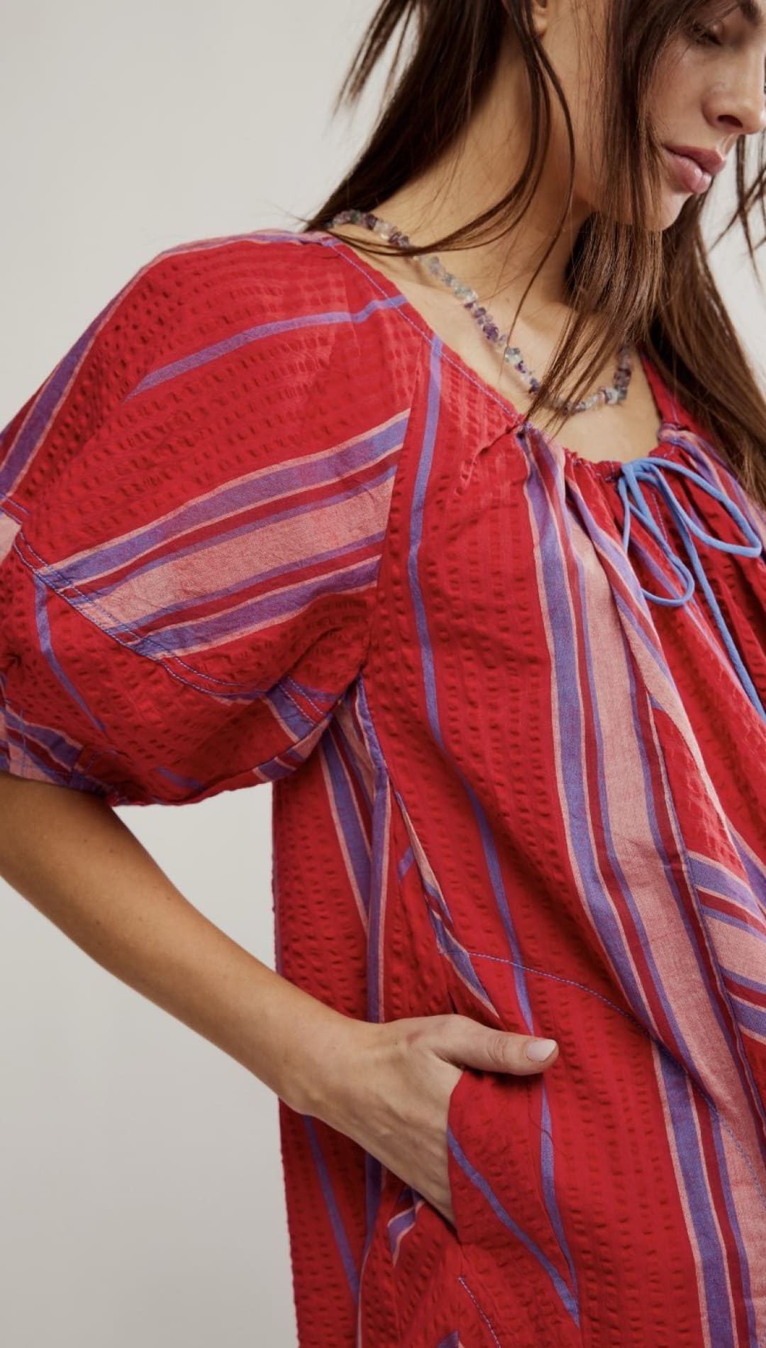 Red striped dress with puffy sleeves.