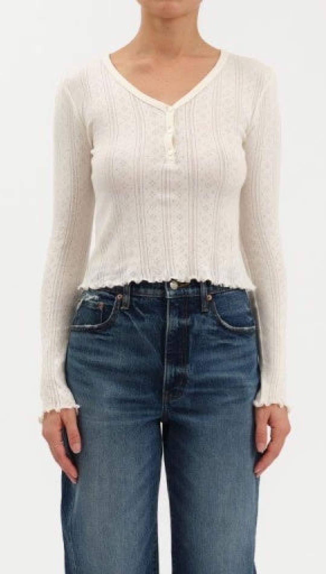 White long-sleeved top with buttons.