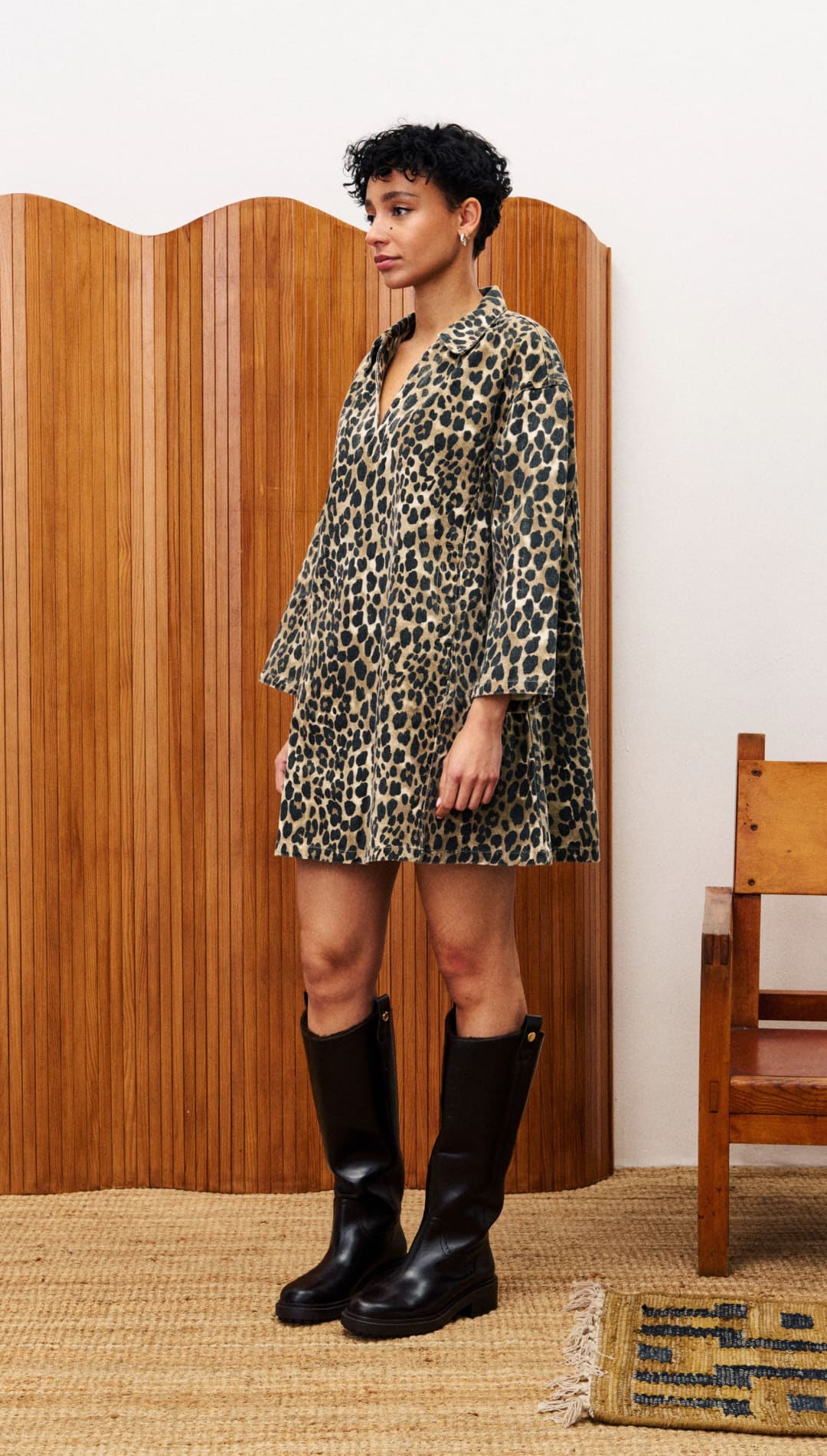 Leopard print mini-dress with long sleeves.