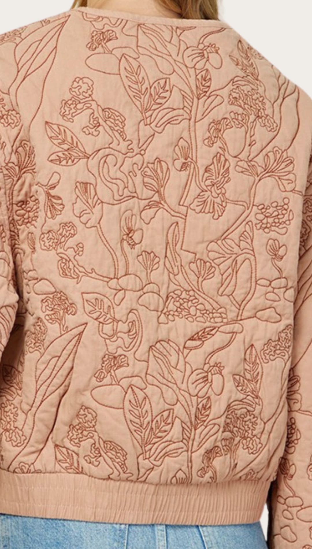 Floral-embroidered quilted jacket.