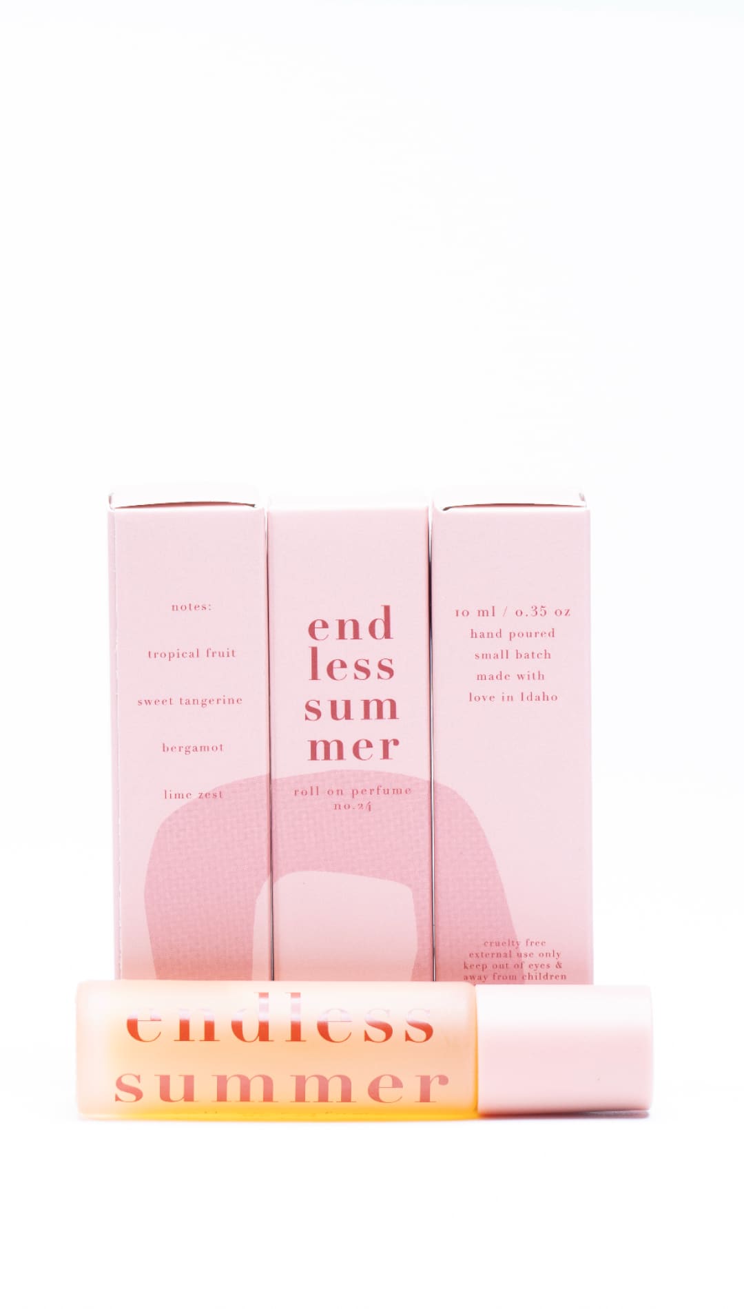 ’chic summer lip balm in a sleek pink tube with white text.’