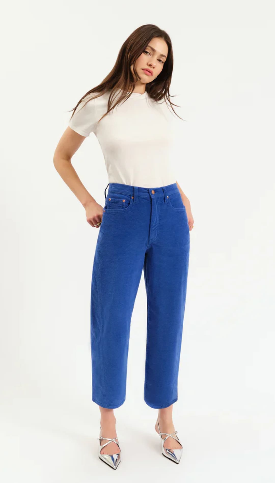 Royal blue high-waisted cropped pants with silver metallic heels and a white t-shirt.