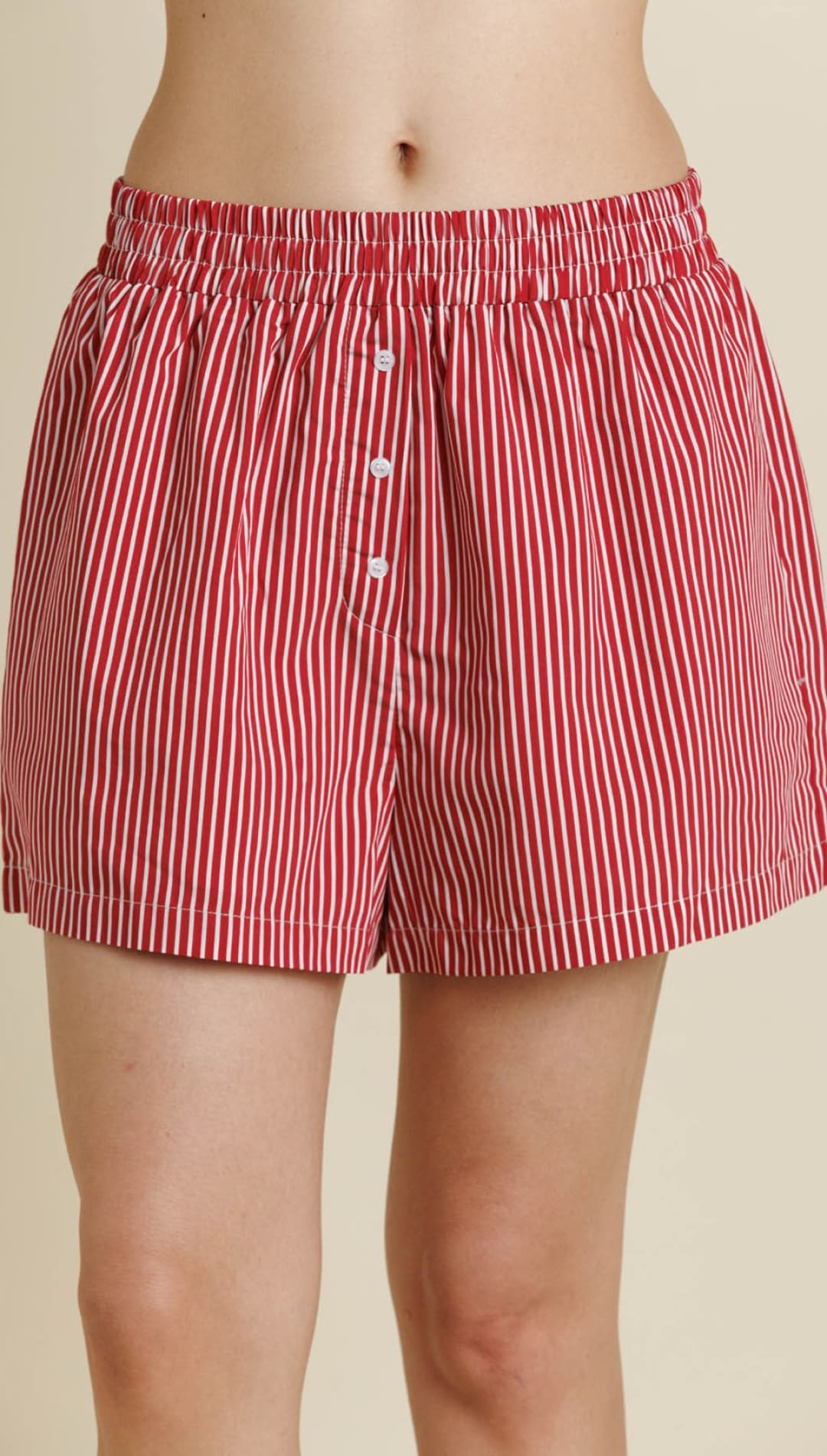 Red and white striped cotton boxer shorts with a button fly.