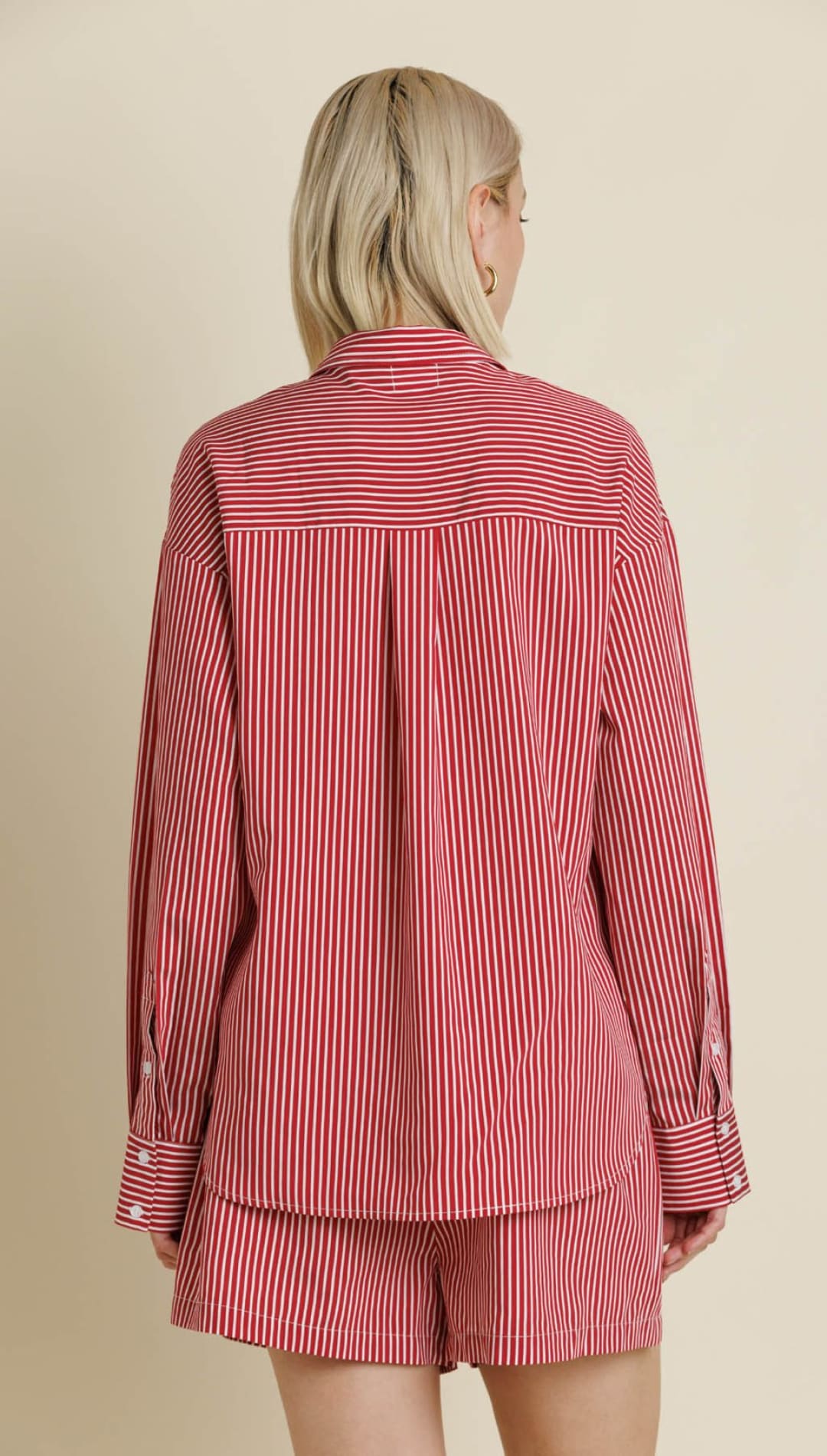 Red and white striped long-sleeve button-up shirt and matching shorts.