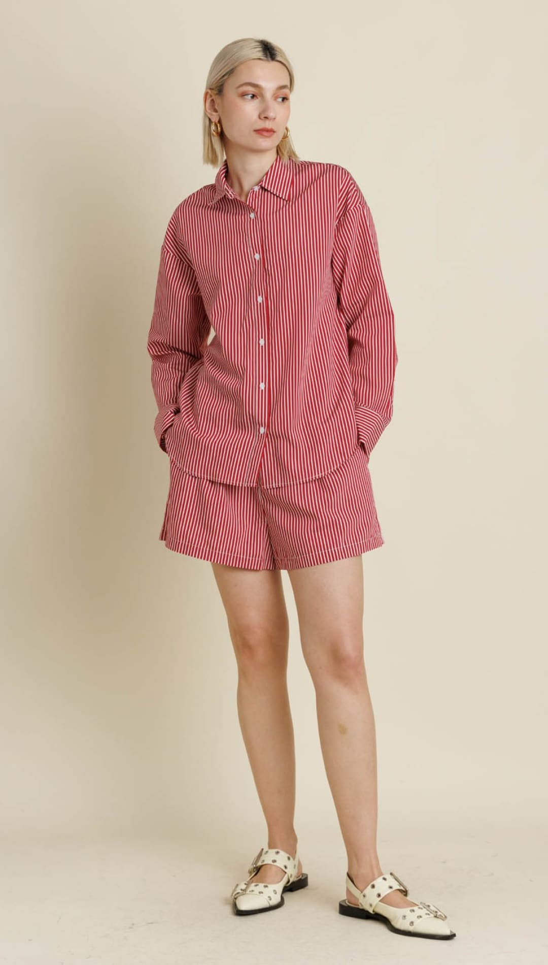 A women’s red and white striped button-down shirt and matching shorts set.