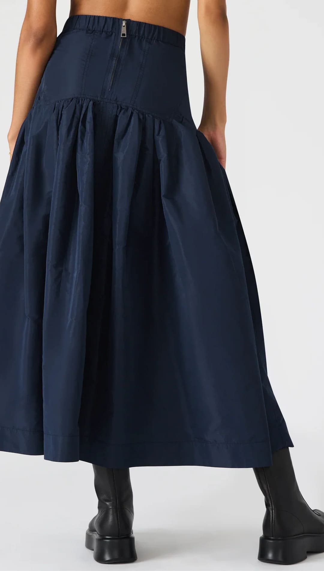 Navy blue high-waisted tiered maxi skirt with a back zipper closure.