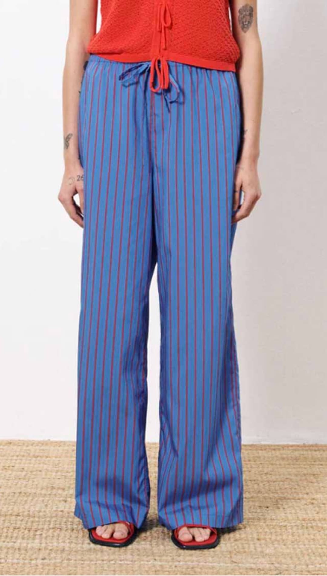 Blue and red striped drawstring pants.