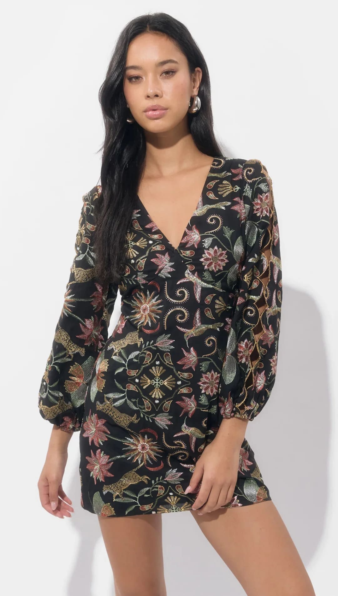 Black floral print mini dress with bell sleeves and a deep v-neck.