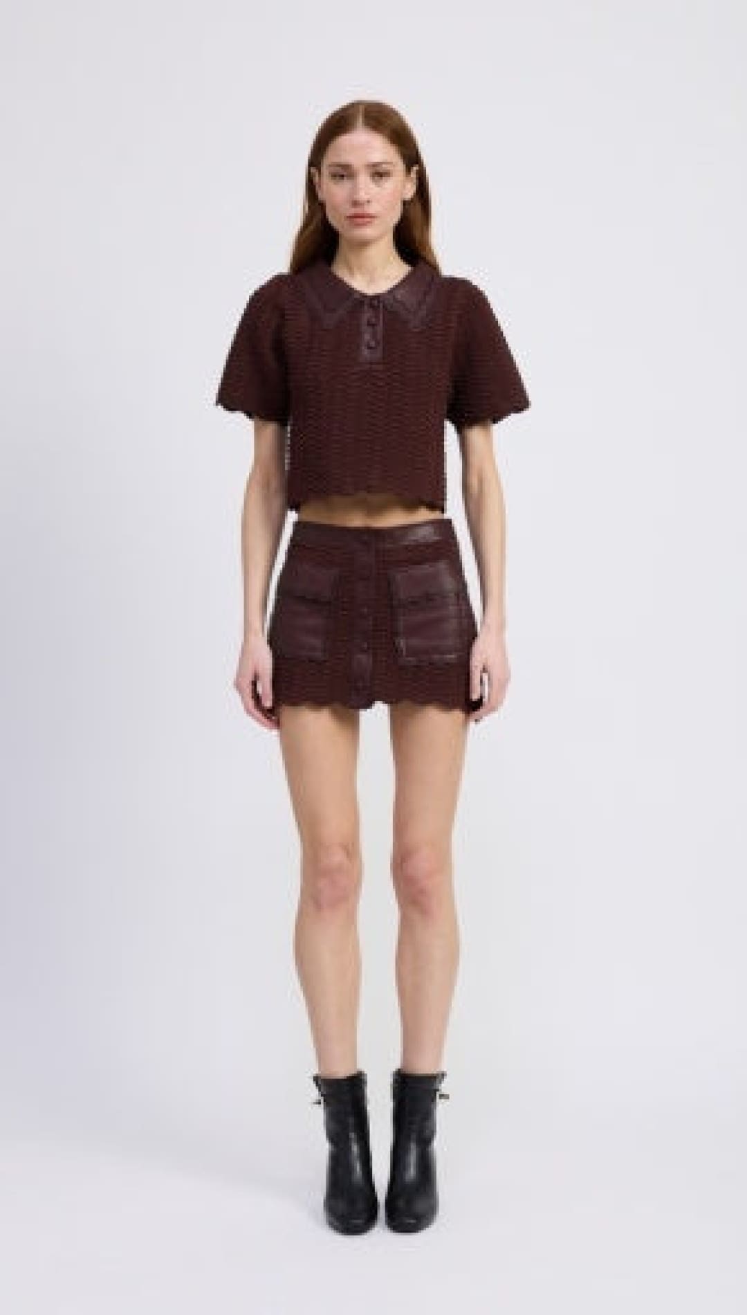 Women’s brown short sleeve cropped top and mini skirt set with black ankle boots