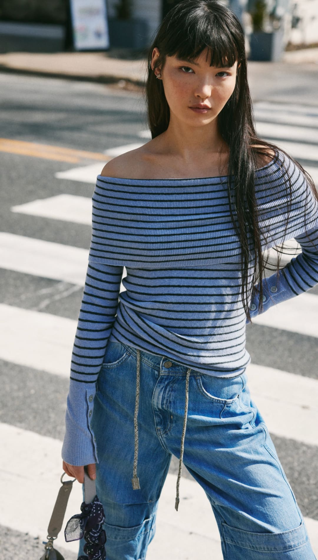 Striped off-the-shoulder long-sleeve top.