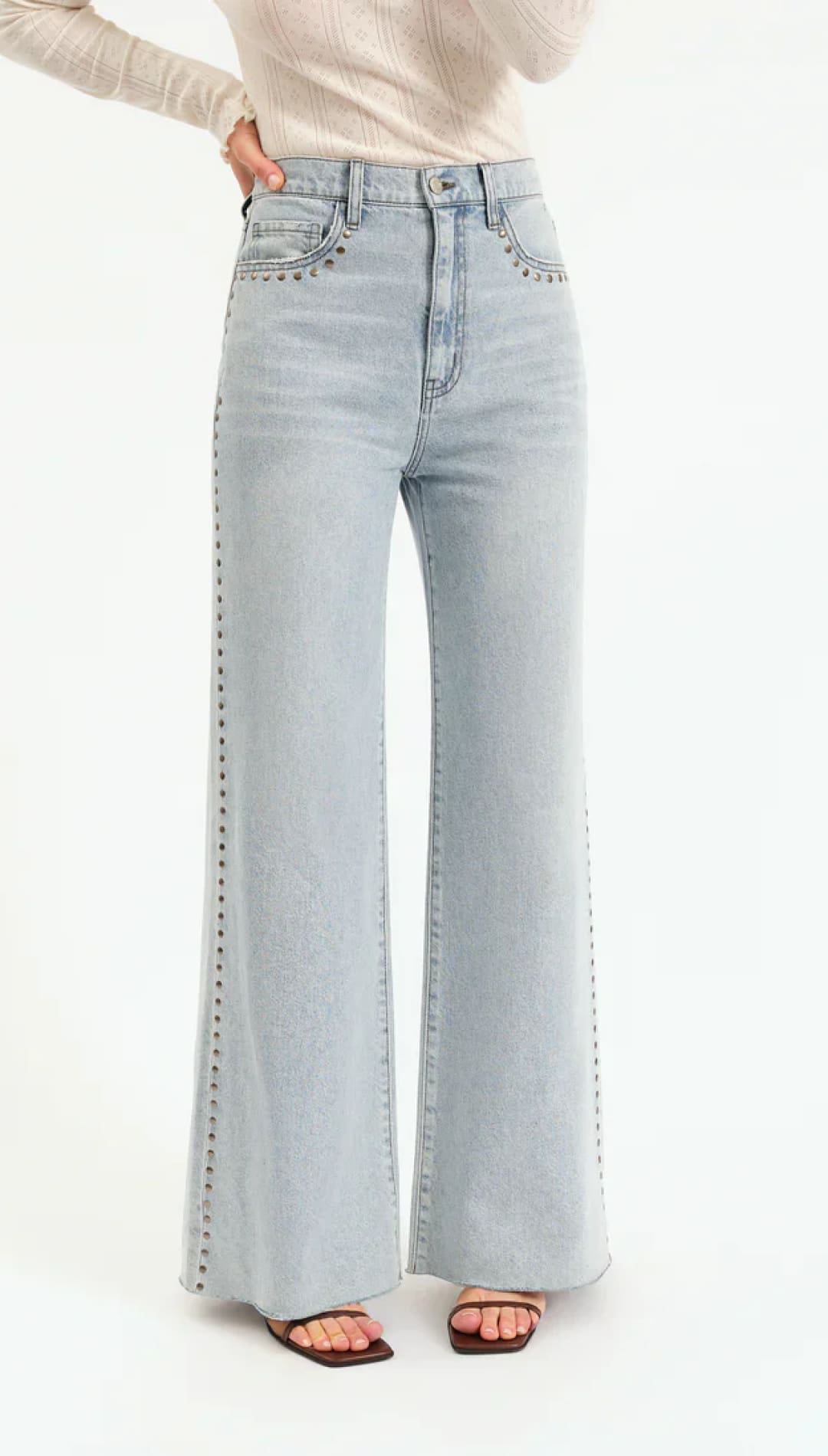 Light blue studded flare jeans.
