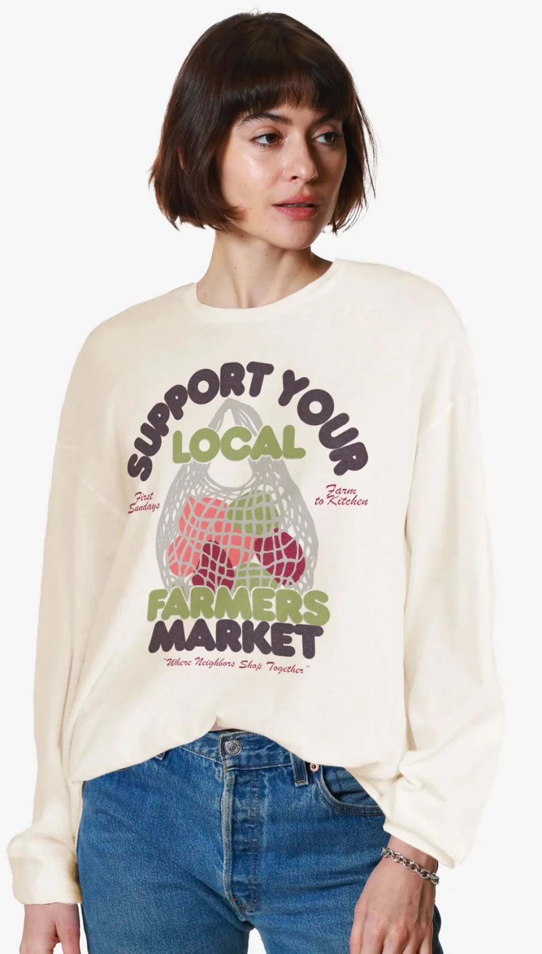 Cream-colored sweatshirt with ’Support Your Local Farmers Market’ graphic.