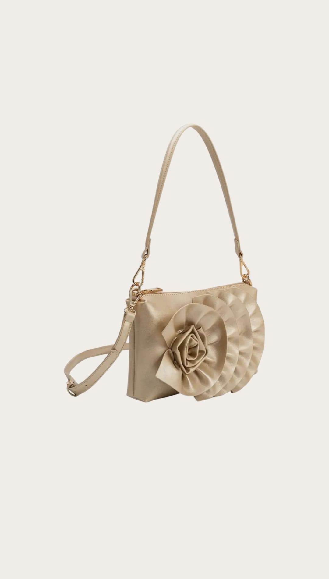 Beige shoulder bag with floral embellishment.