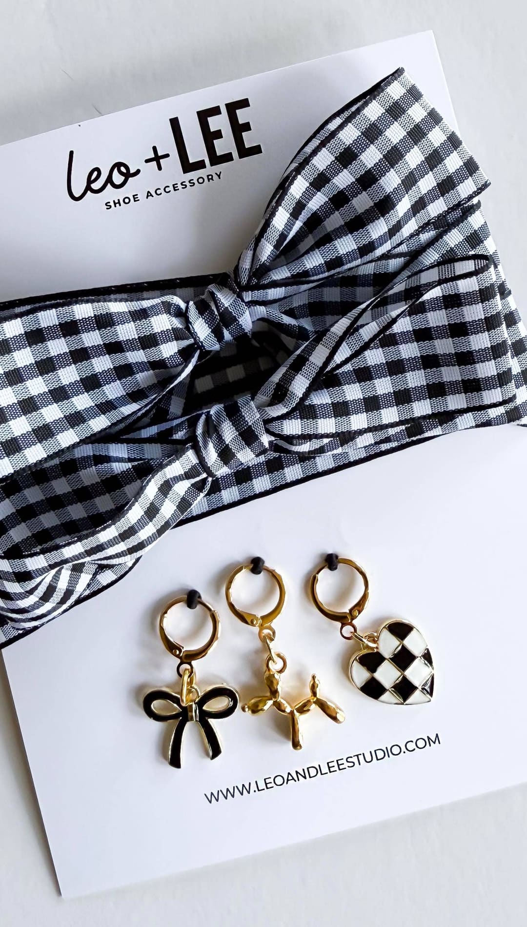 Shoe accessory set with gingham bow.