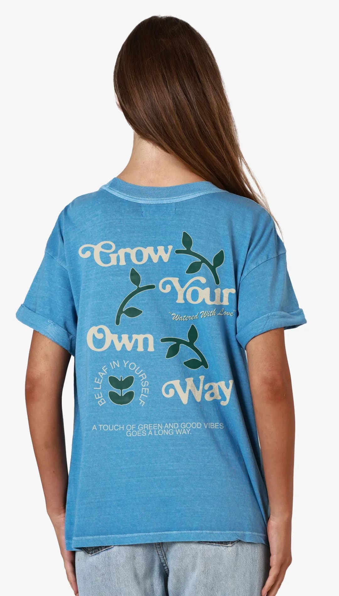 Blue t-shirt with plant-themed graphic.