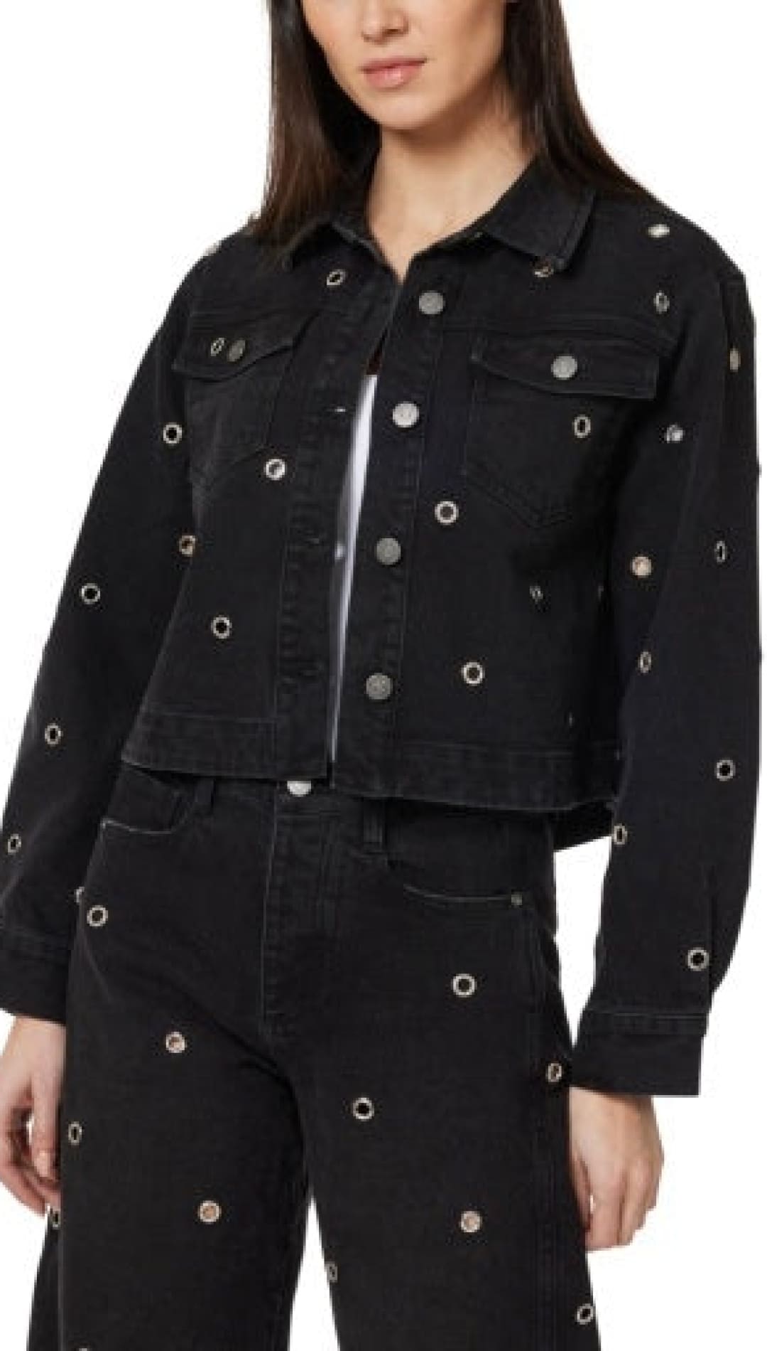 Black denim jacket with silver eyelet details and zipper, possibly by levi’s.