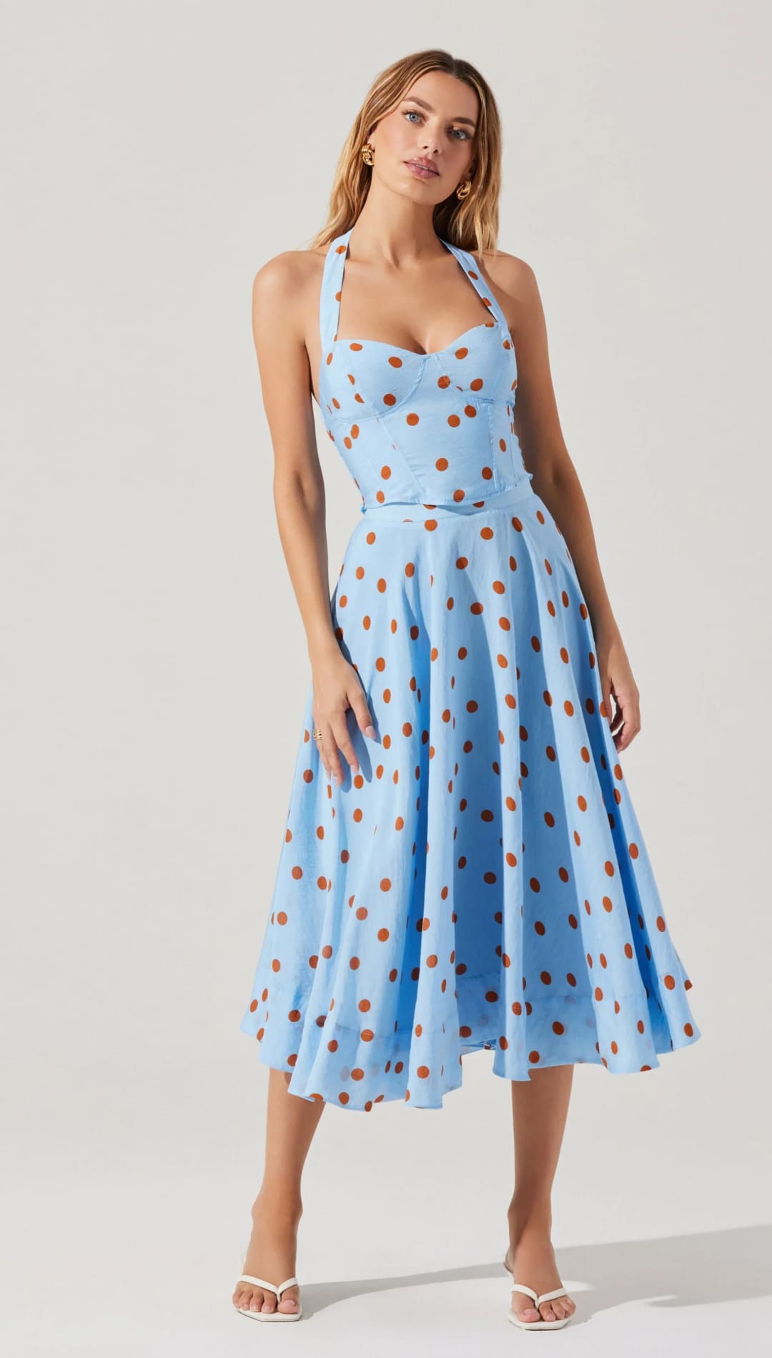 Light blue halter dress with brown polka dots.