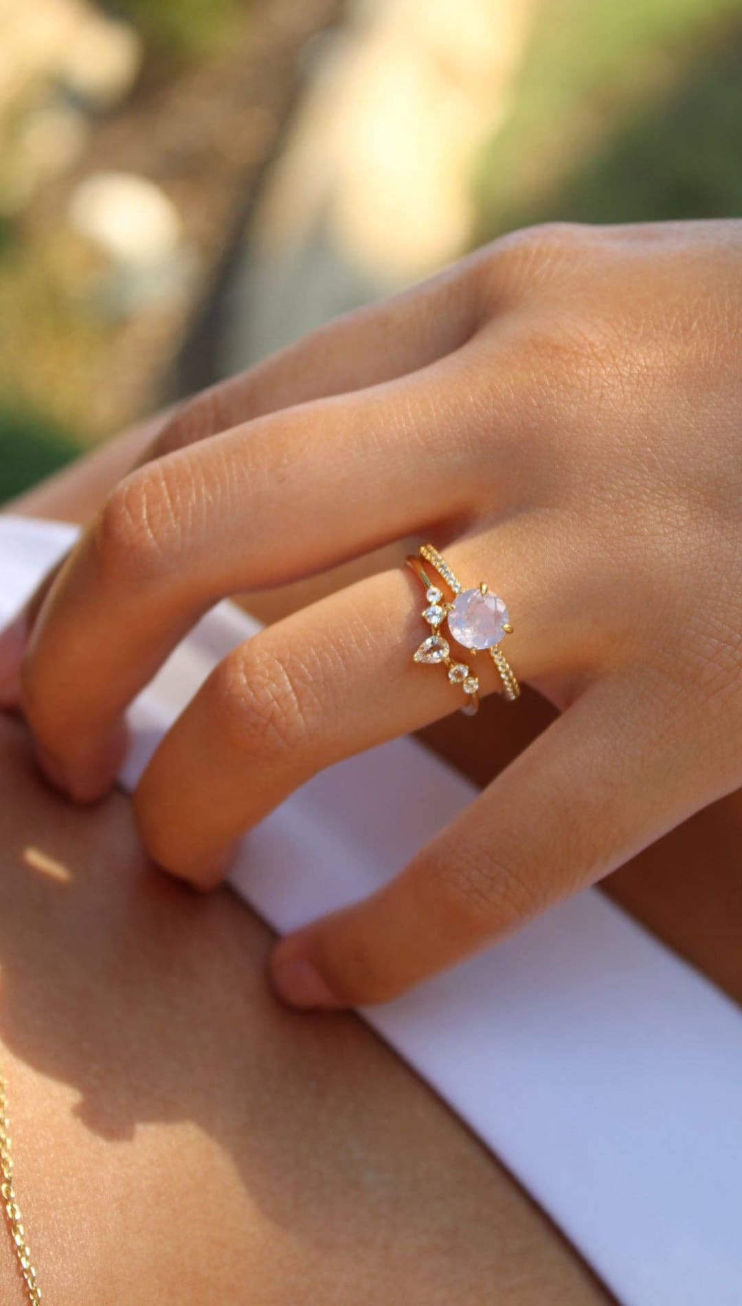 Gold ring with a pink stone.
