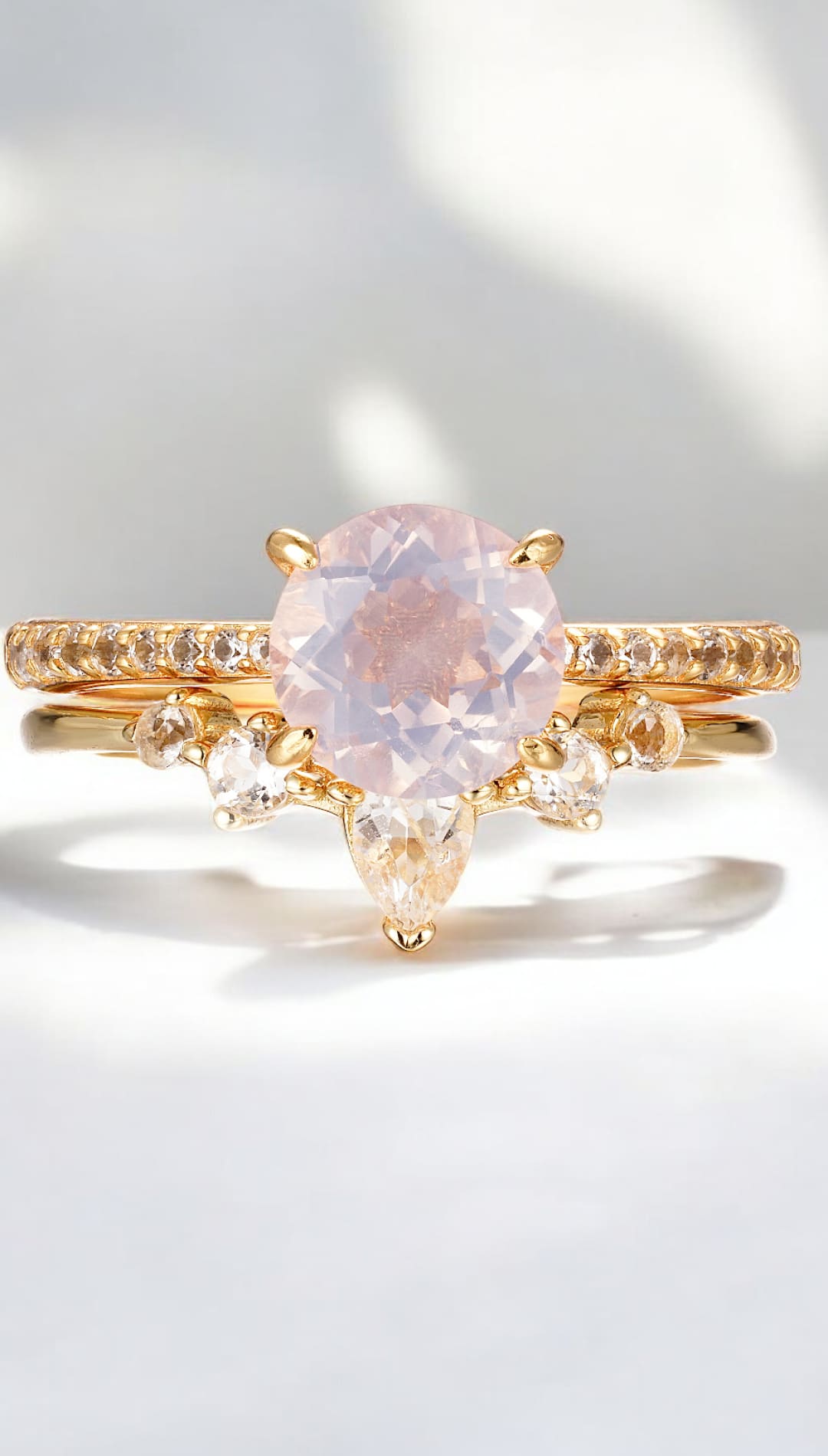 Gold ring with pink gemstone.