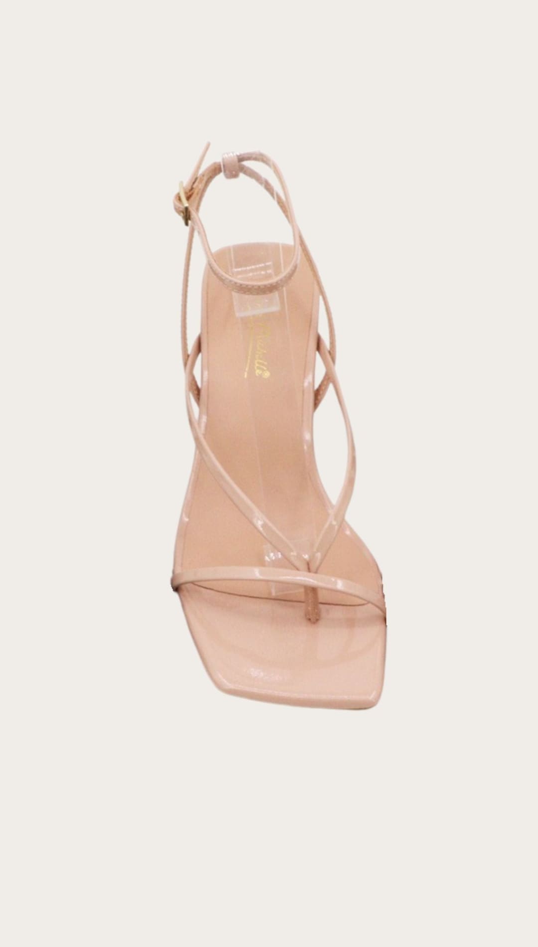 Beige strappy heeled sandal.