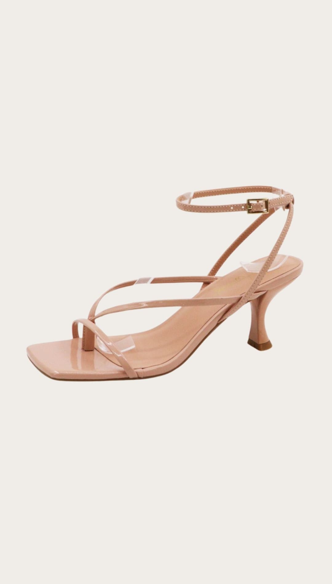 Nude-colored strappy heeled sandal.