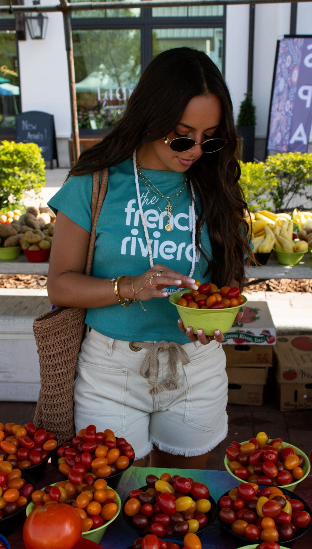 Woman selecting tomatoes.