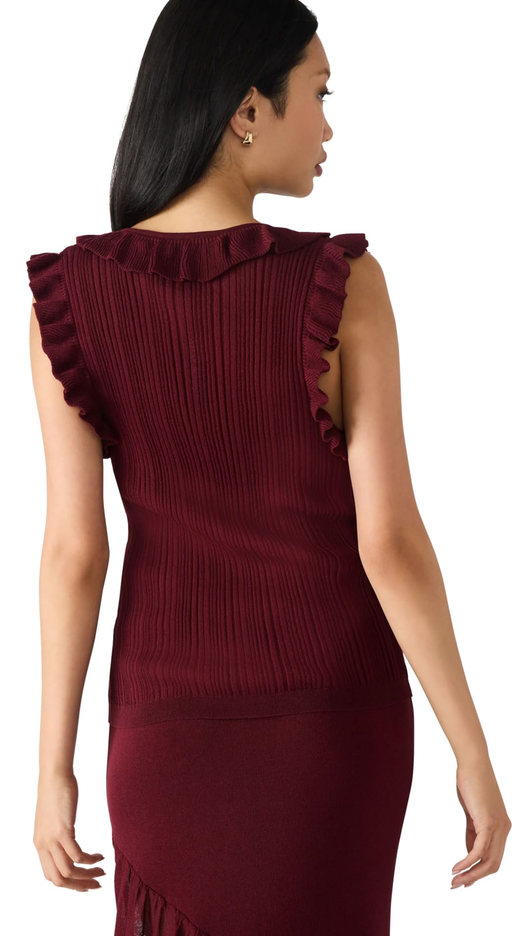 A sleeveless, ruffled, pleated, maroon-colored top with a matching skirt.