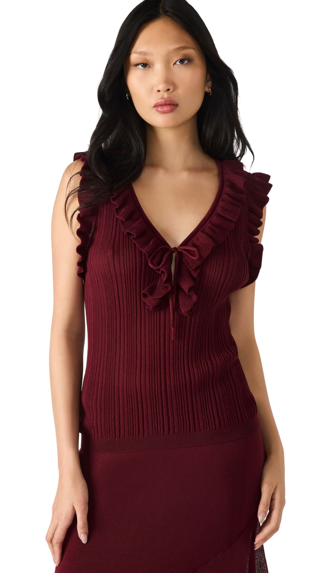 A women’s sleeveless ribbed knit top and matching skirt in a dark red color.