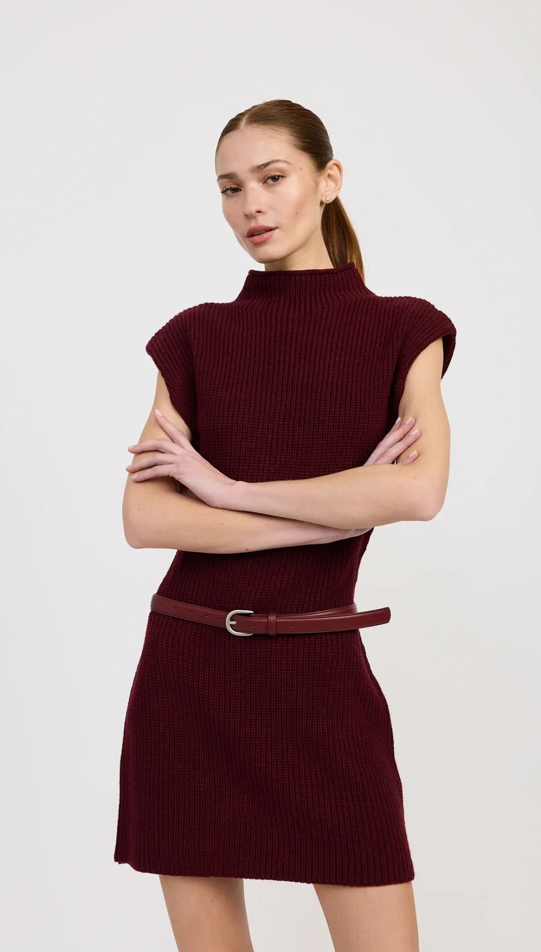 Burgundy ribbed knit mock-neck short dress with a thin matching belt.
