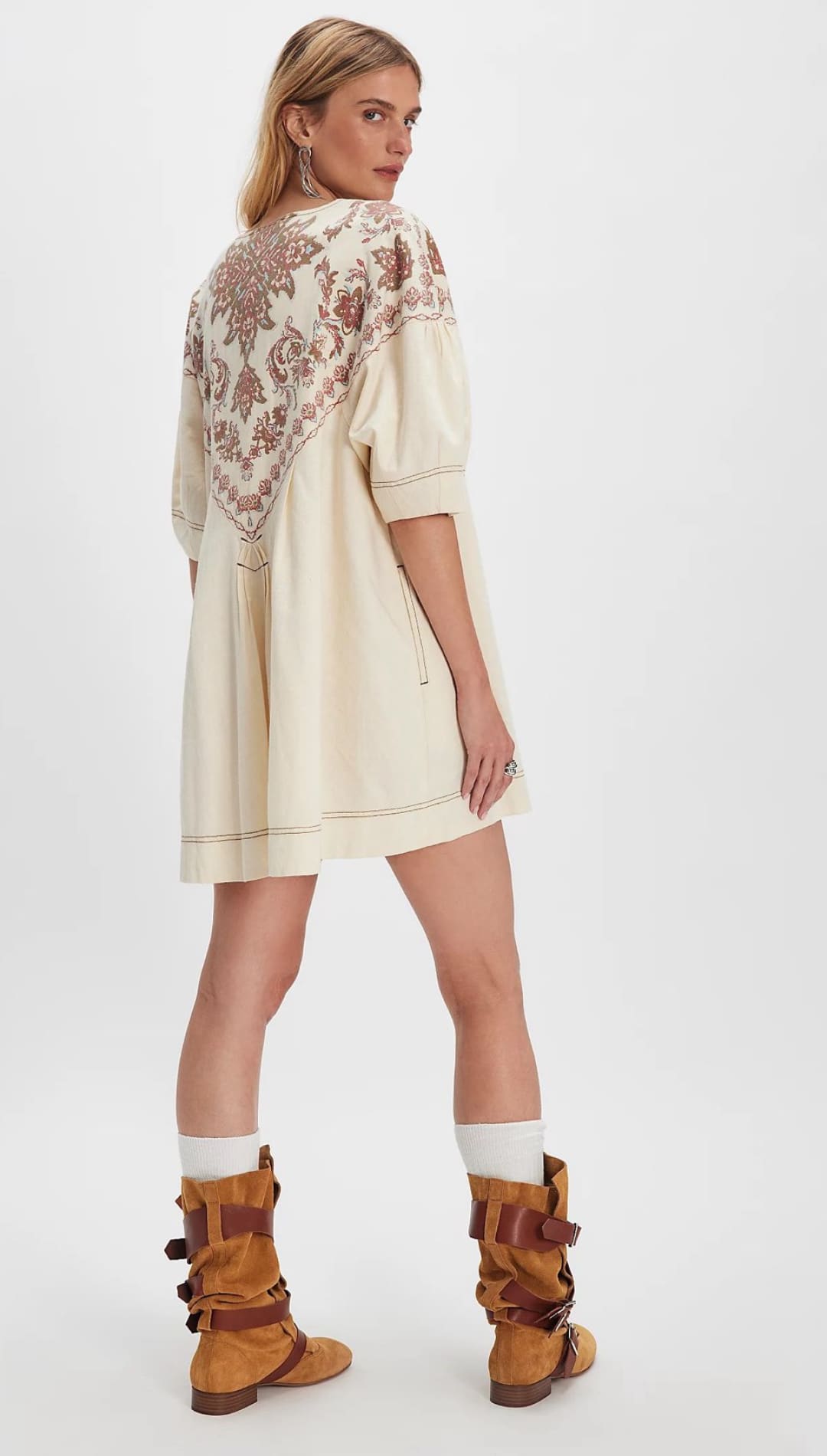 Cream-colored dress with embroidered back.