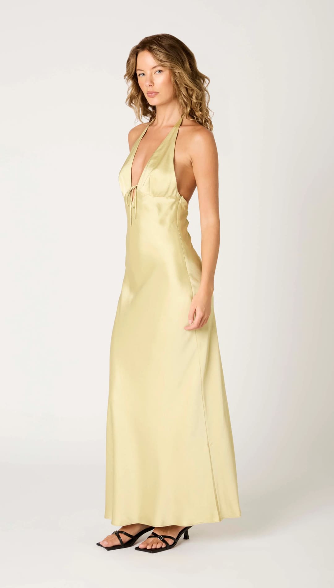 Woman in a yellow halter dress.