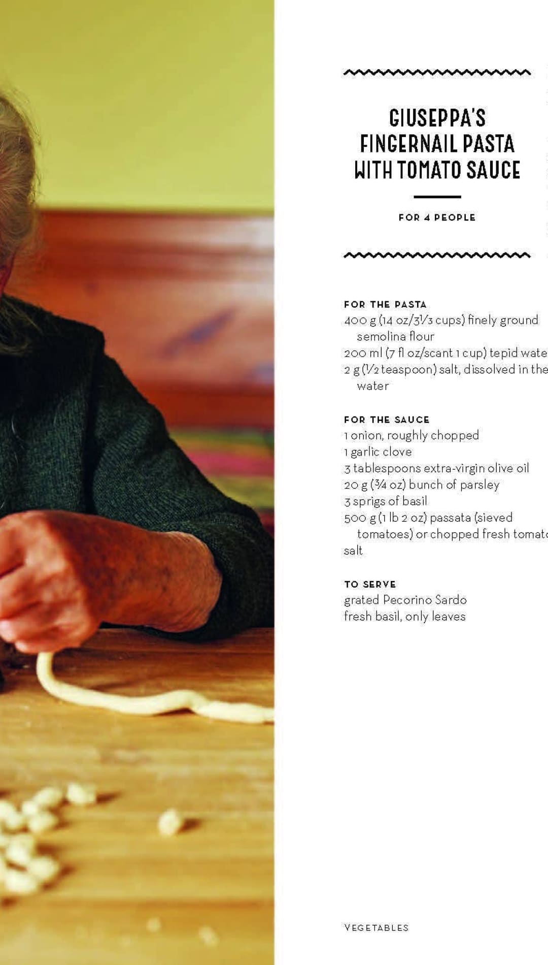 Antique wooden pasta maker with hand-carved details and a rustic finish.