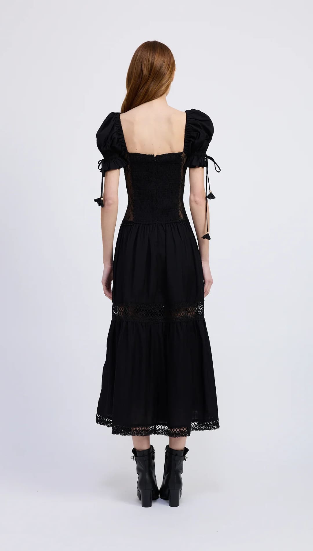 Black midi dress with puffed sleeves and lace details.