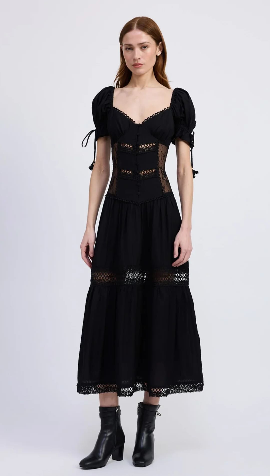 Women’s black midi dress with puffed sleeves and lace inserts.