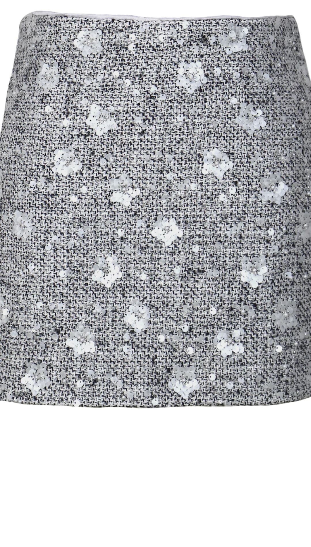 Tweed mini skirt with silver sequins and floral pattern, gray background.