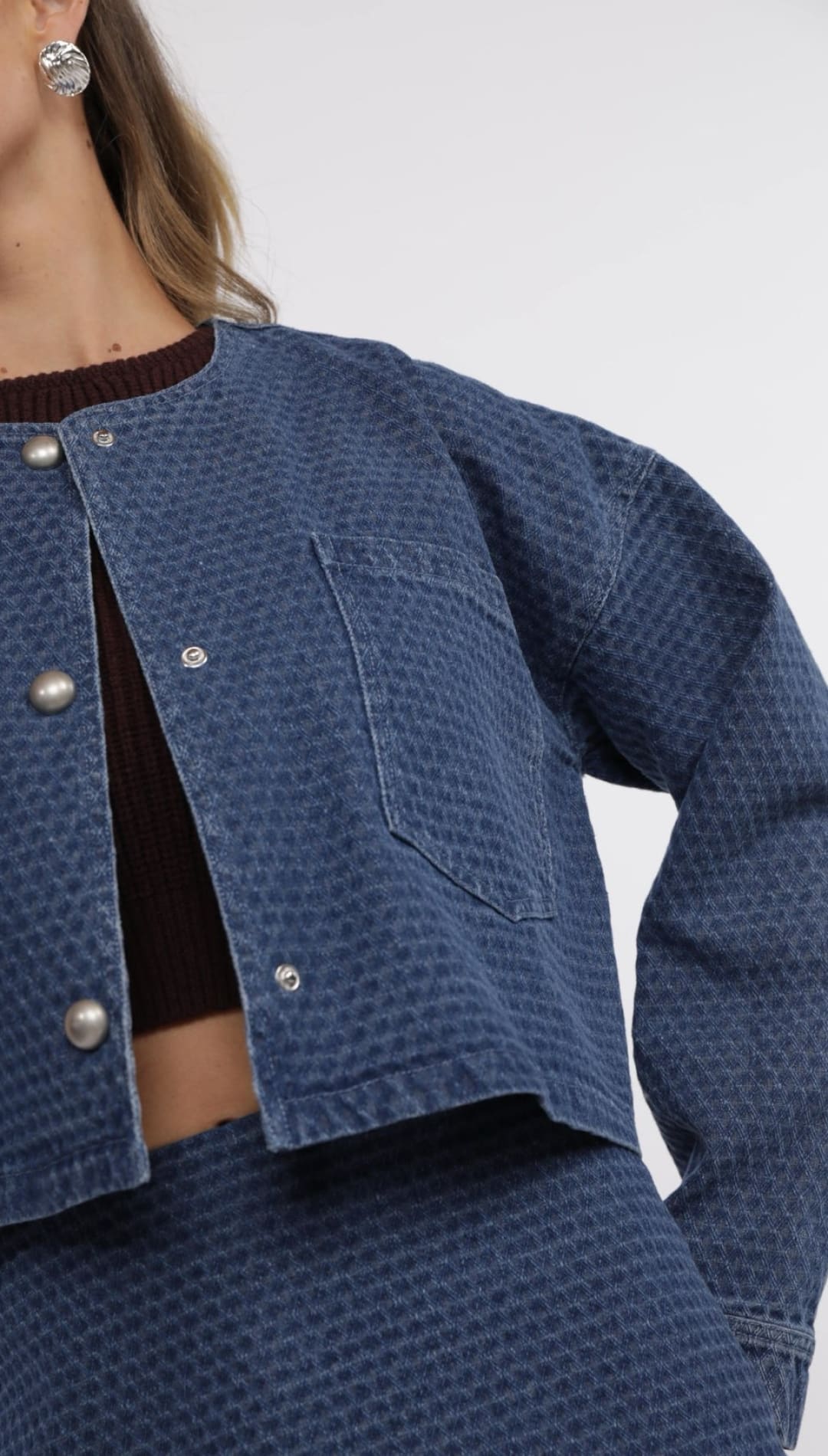 Blue textured denim jacket.
