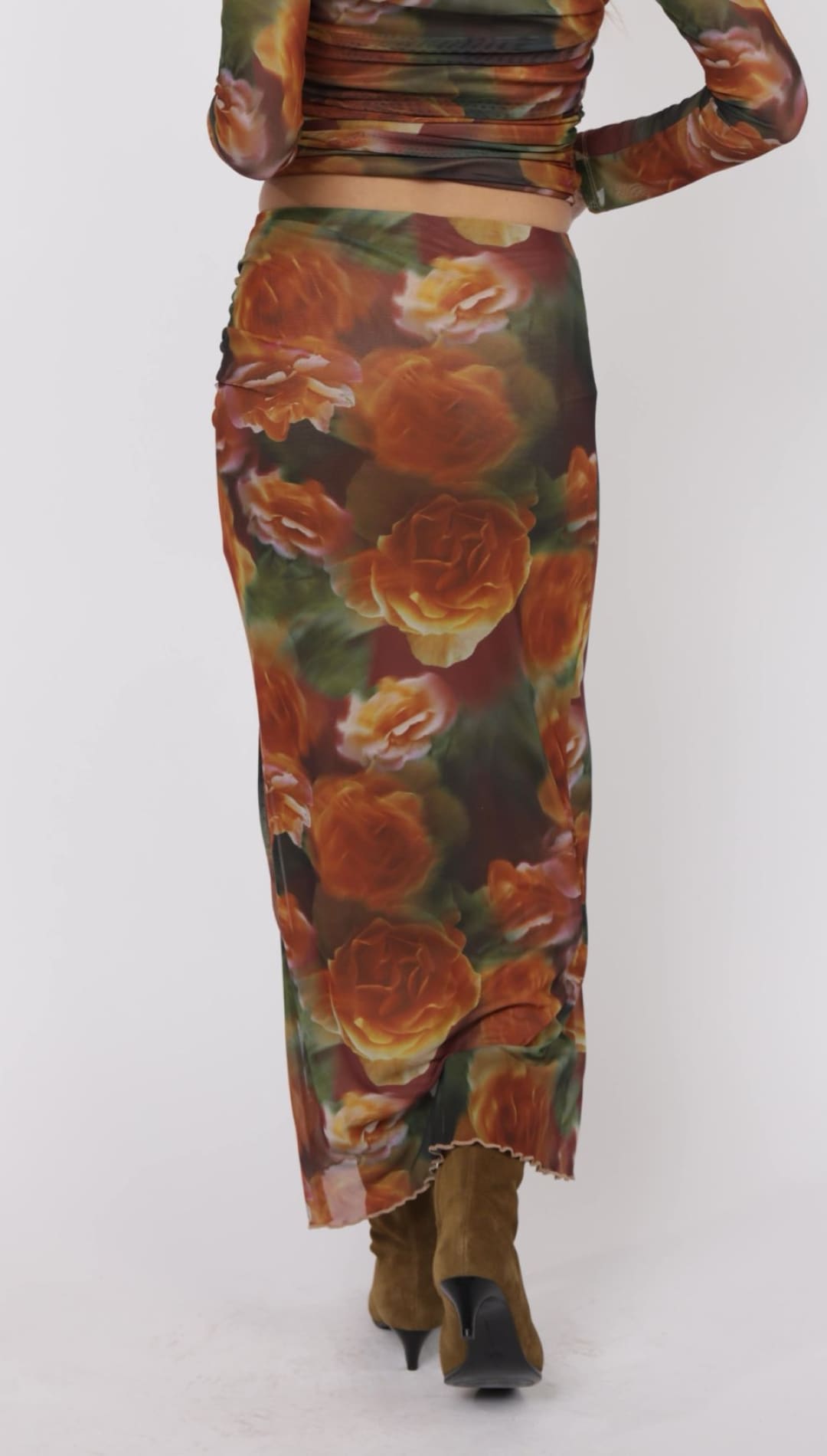 Floral-patterned mesh skirt.