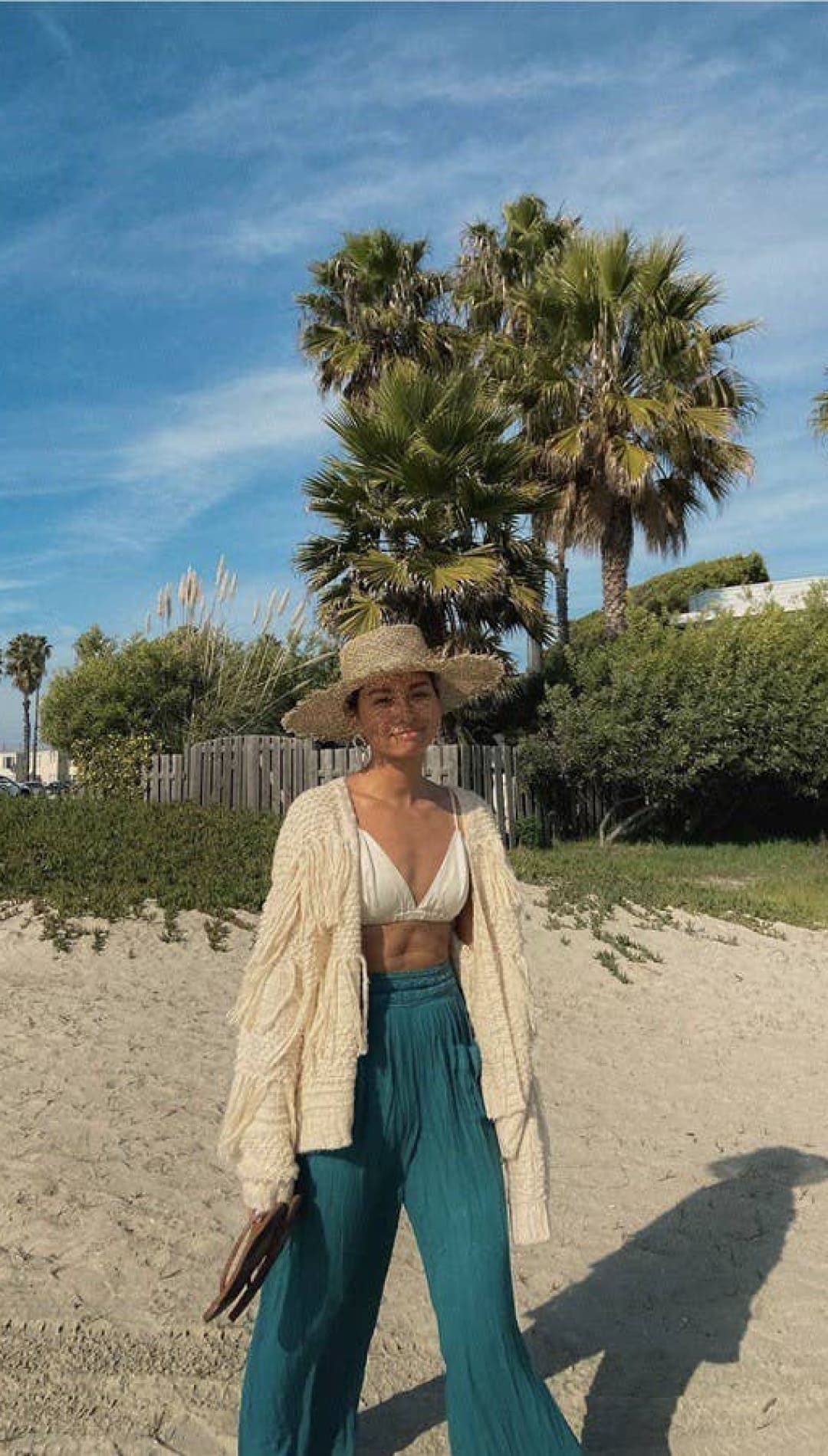 Woman in beach attire.