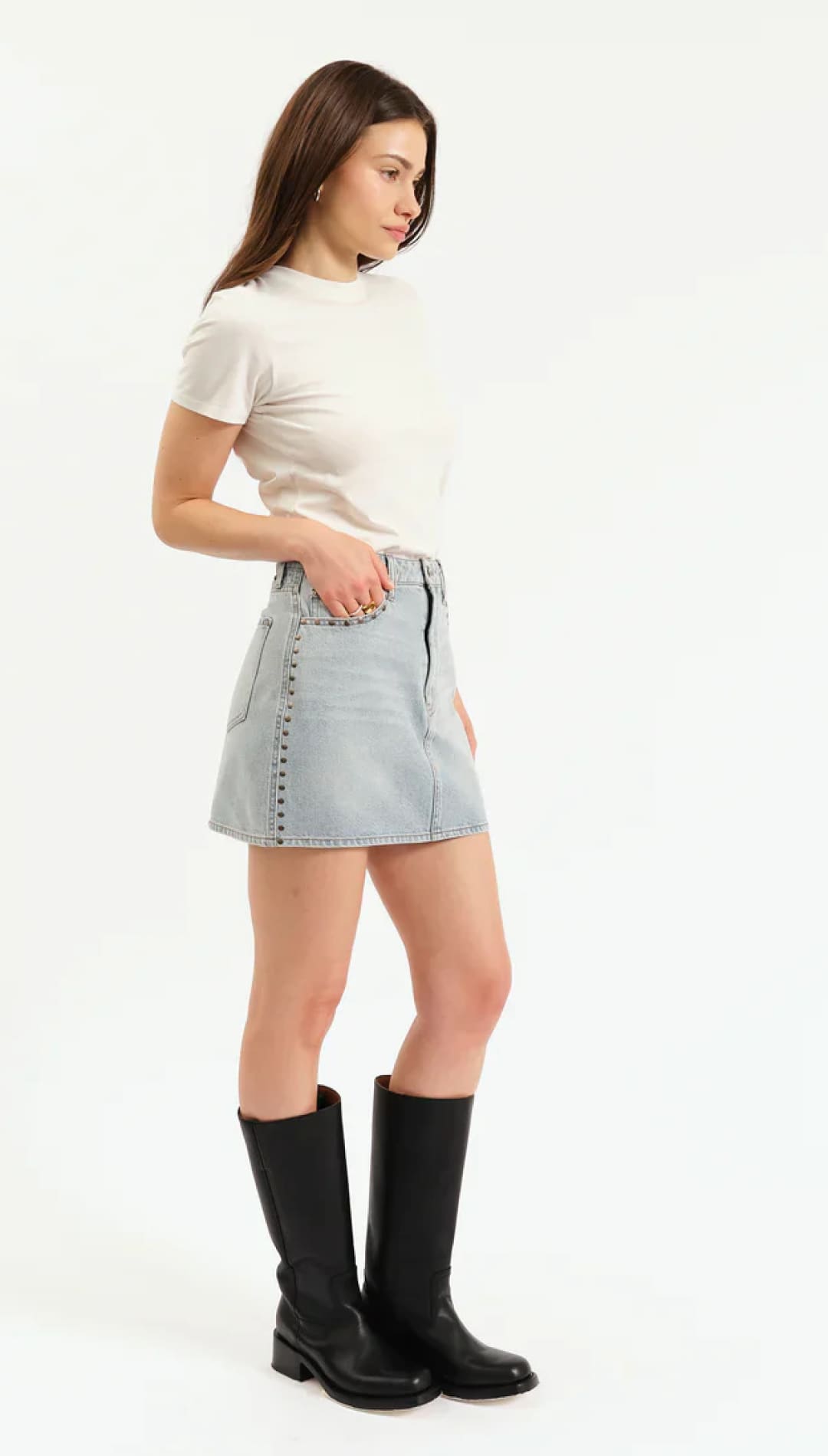 A light blue studded denim mini skirt.
