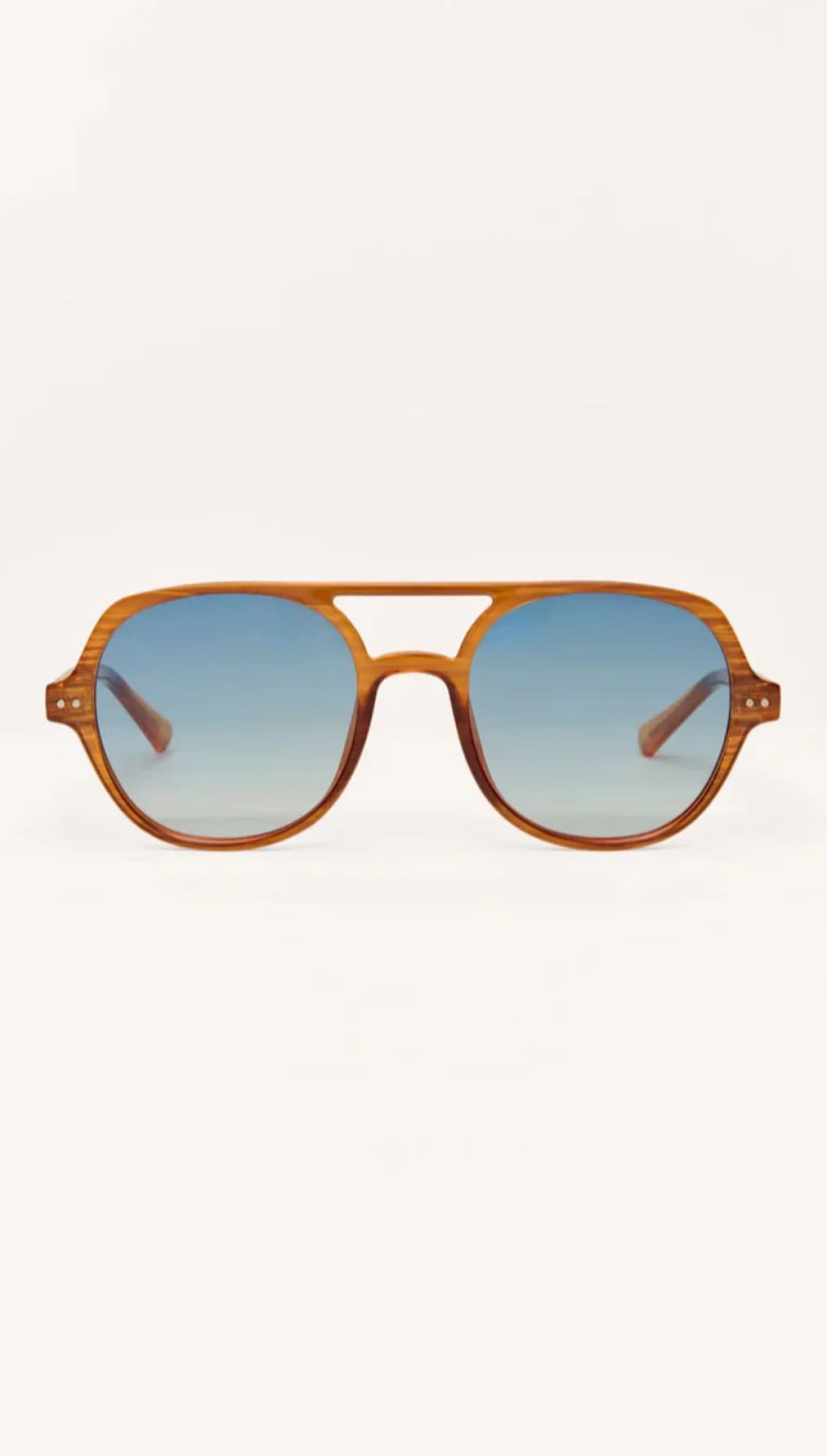 Aviator sunglasses with tortoiseshell frame and gradient blue lenses.