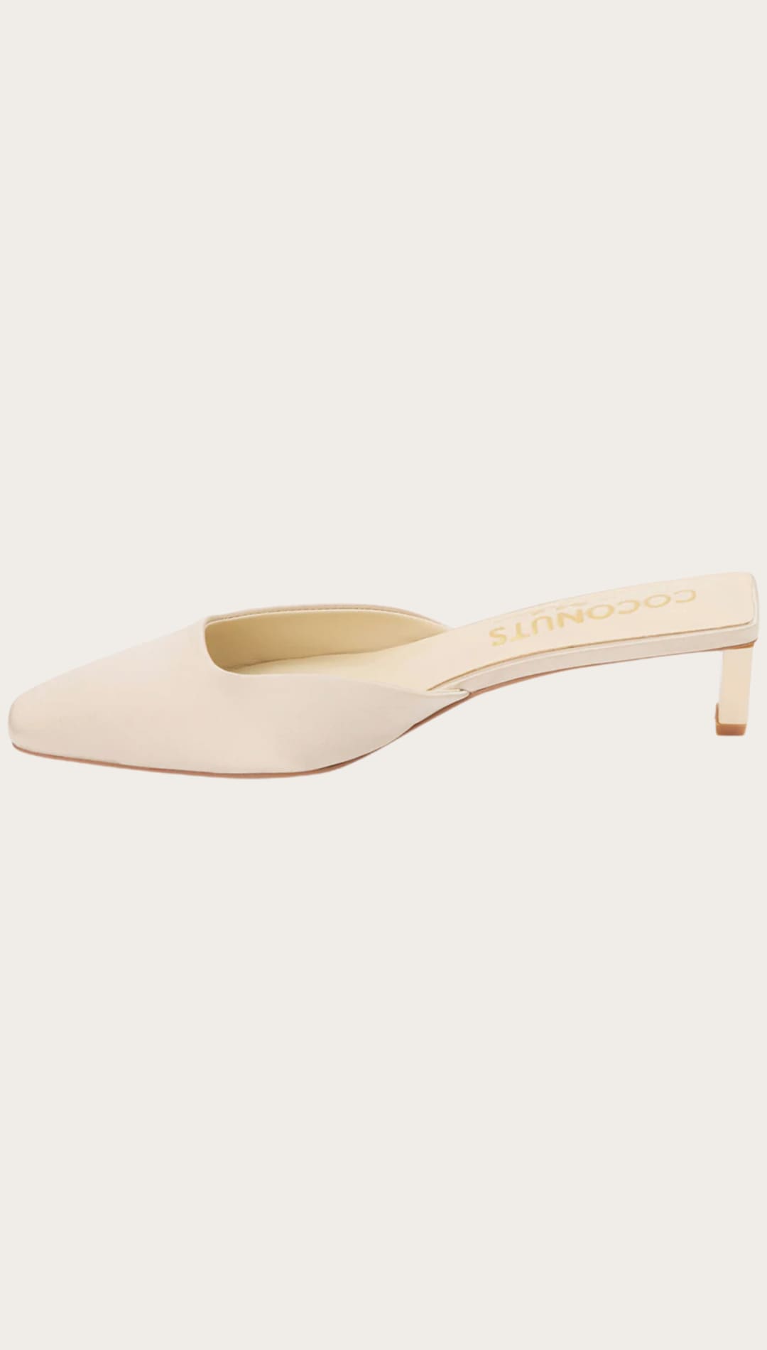 Beige square-toe heeled mule.